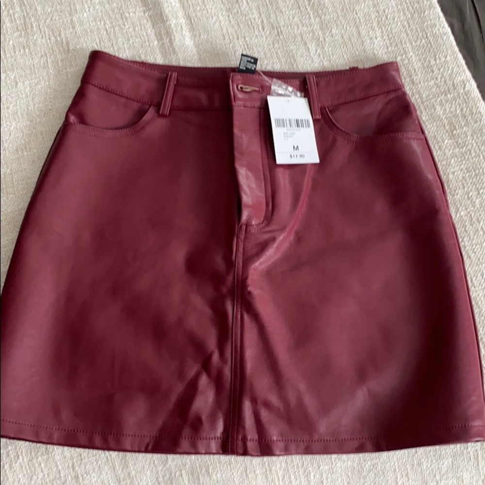 New burgundy Faux leather skirt. Size Medium